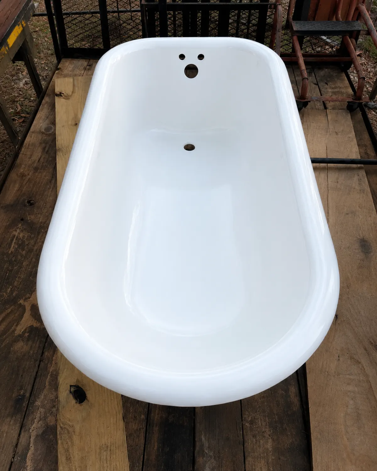 Same clawfoot tub after BathMasters restoration on the Gulf Coast, glossy white porcelain finish