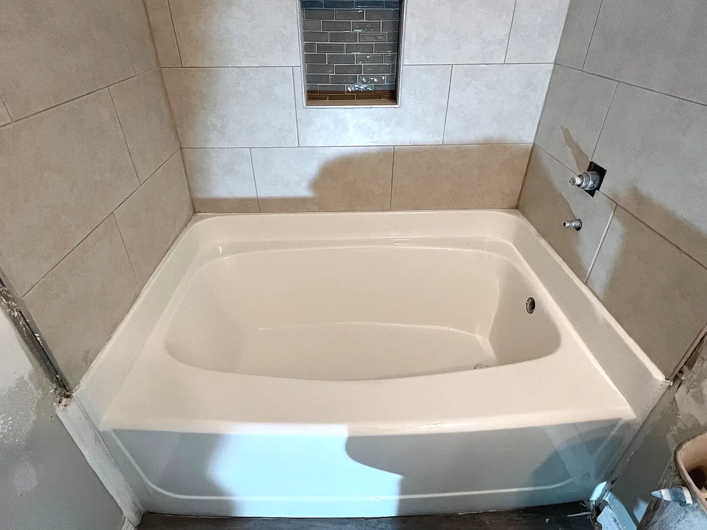 Same cast-iron bathtub after BathMasters refinishing on the Gulf Coast, smooth white finish