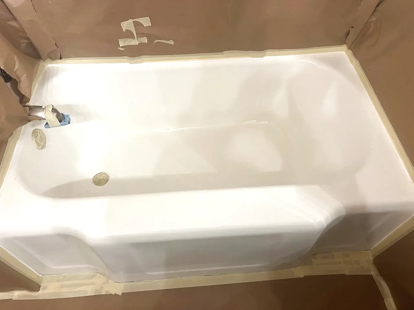 Same bathtub after BathMasters refinishing on the Gulf Coast, glossy white finish